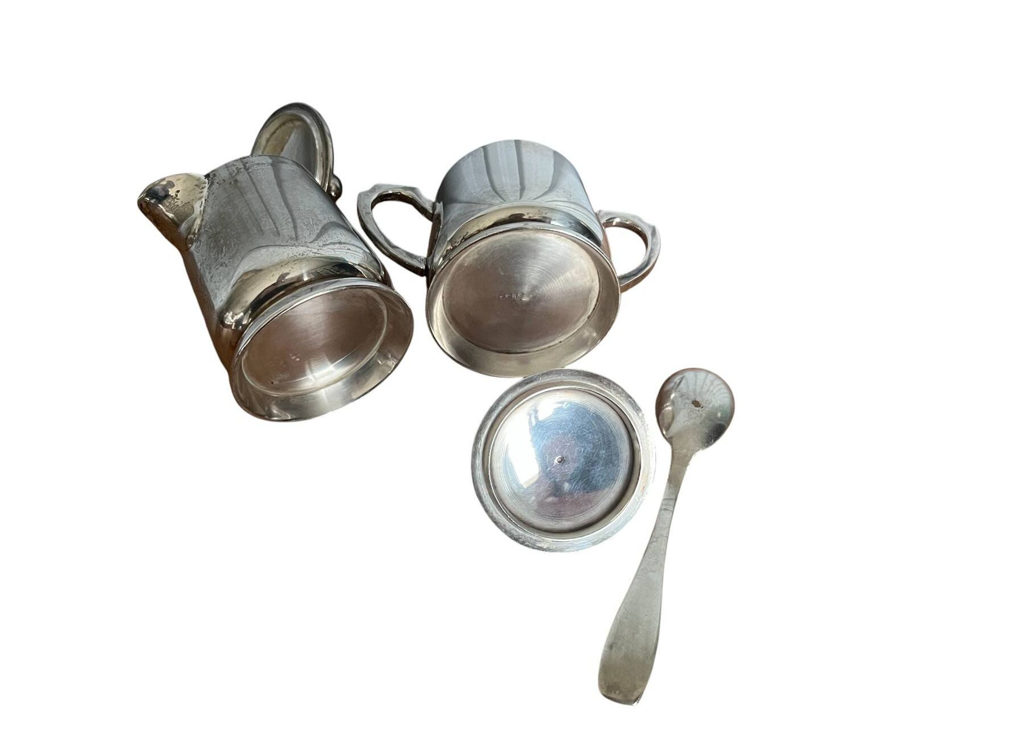Two small silver-plated metal tea service pots from the 20th century.