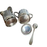 Two small silver-plated metal tea service pots from the 20th century.