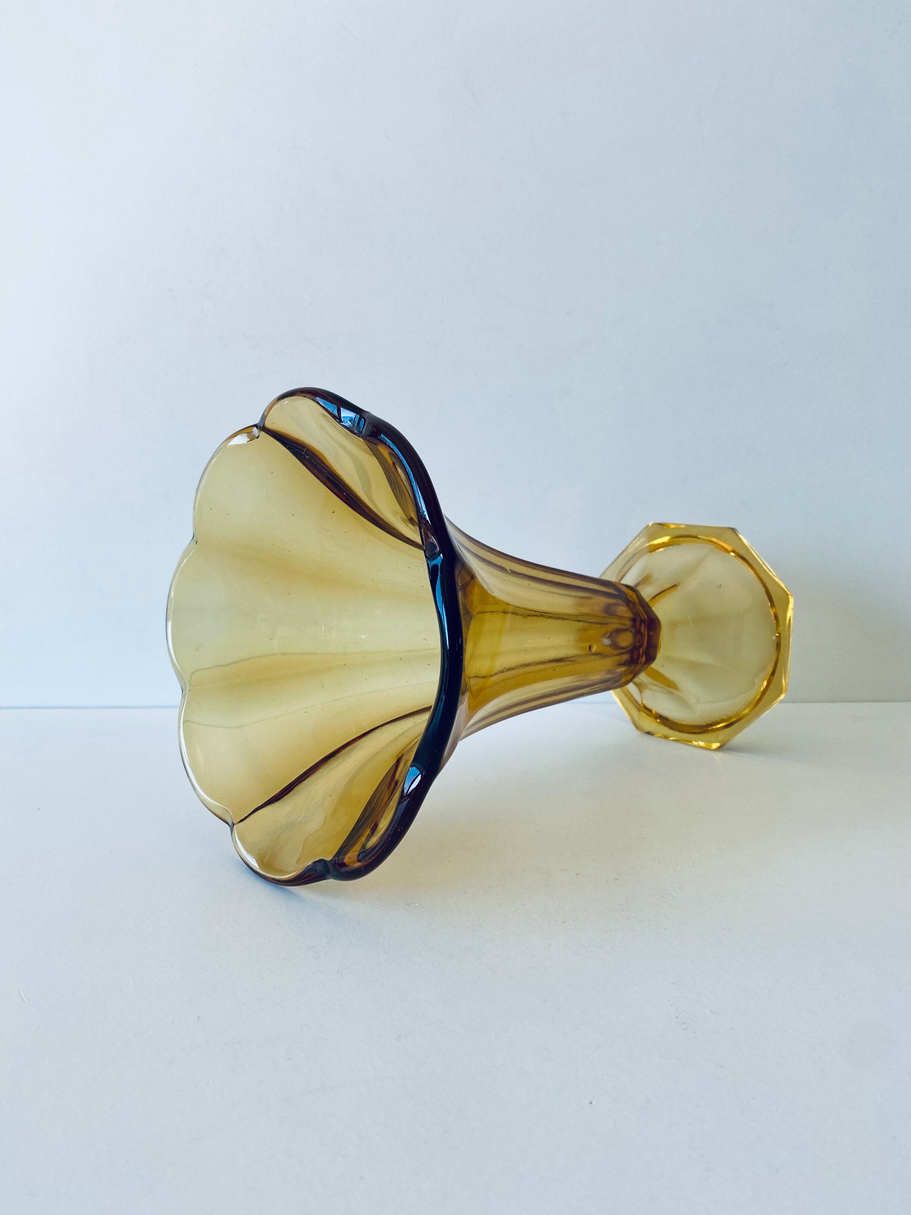 Ancient tulip vase in amber glass