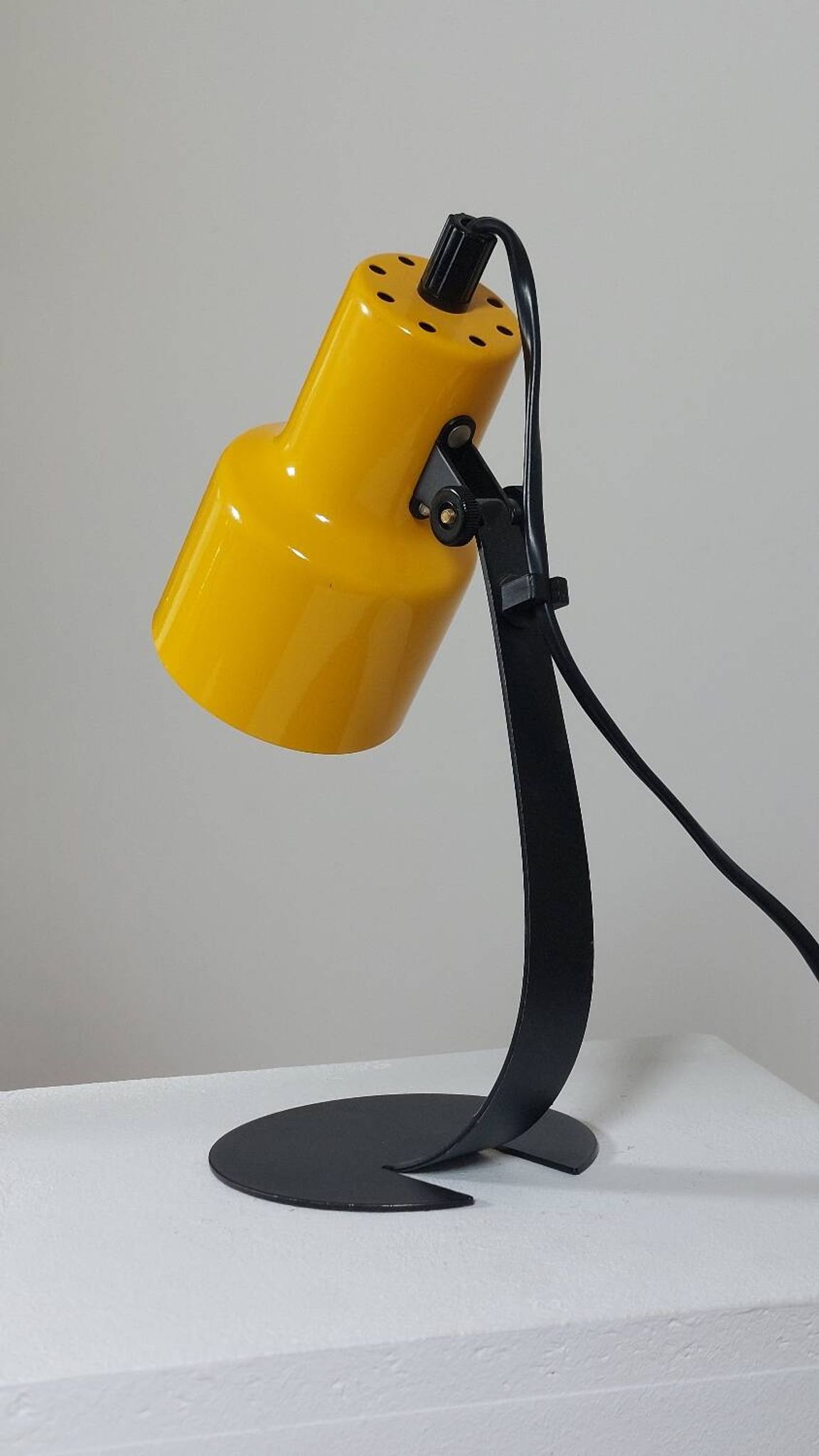 A pair of well-designed minimalist bedside lamps.