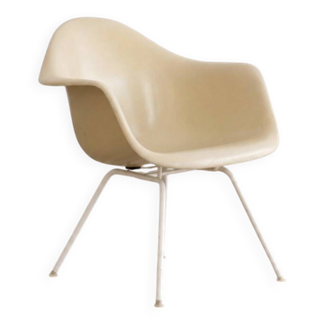 Eames fiberglass armchair by herman miller with white lax base