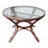 Round rattan and wicker table with glass top
