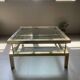 Vintage 1970s coffee table brass chrome Maison Jansen style with a top cover.