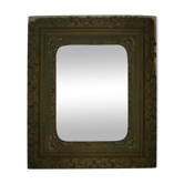 Old wooden frame and brass ornament