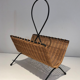 Rattan and black lacquered metal magazine rack