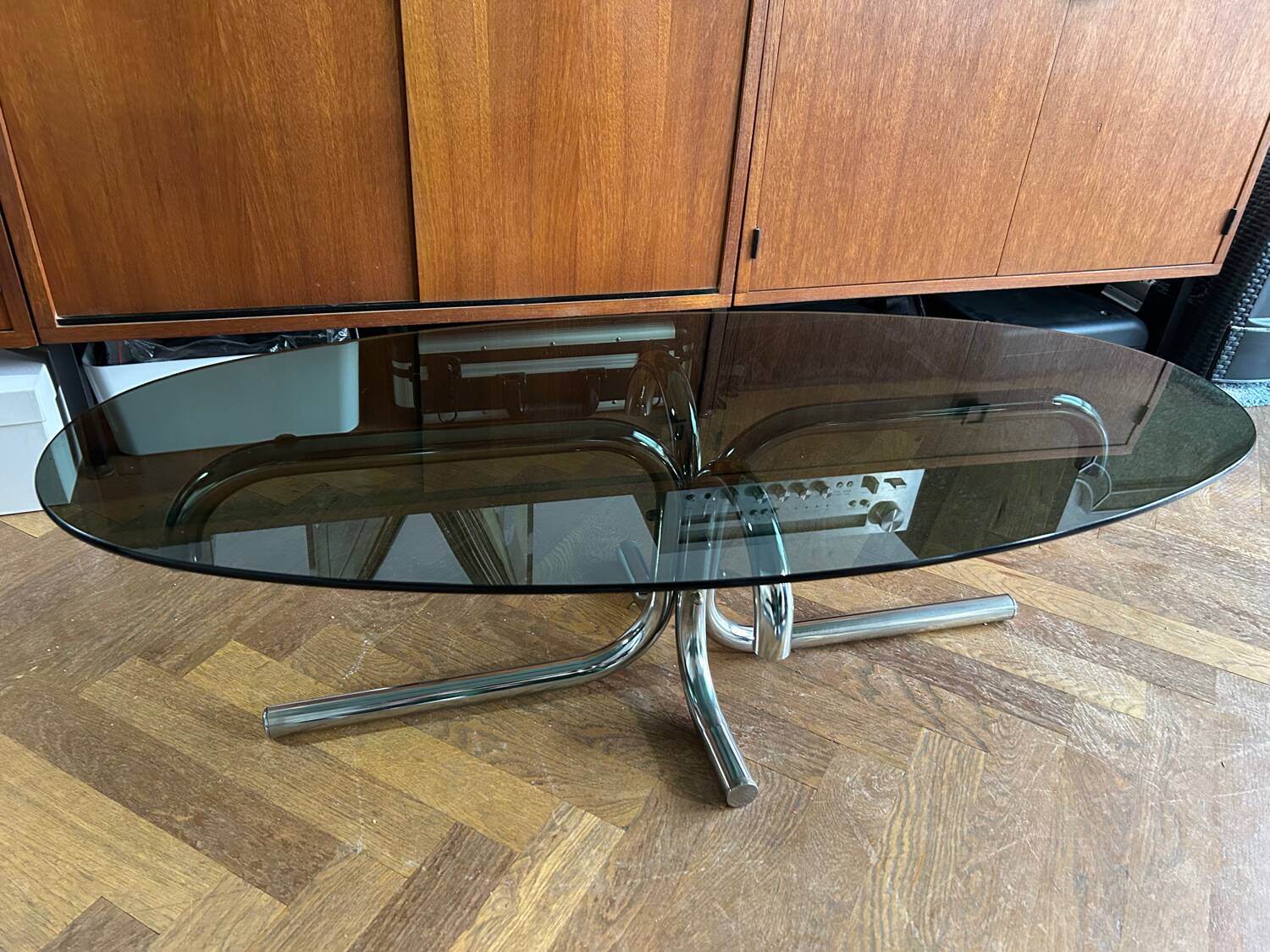 70s design oval coffee table in smoked black glass with chrome legs.