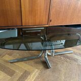 70s design oval coffee table in smoked black glass with chrome legs.
