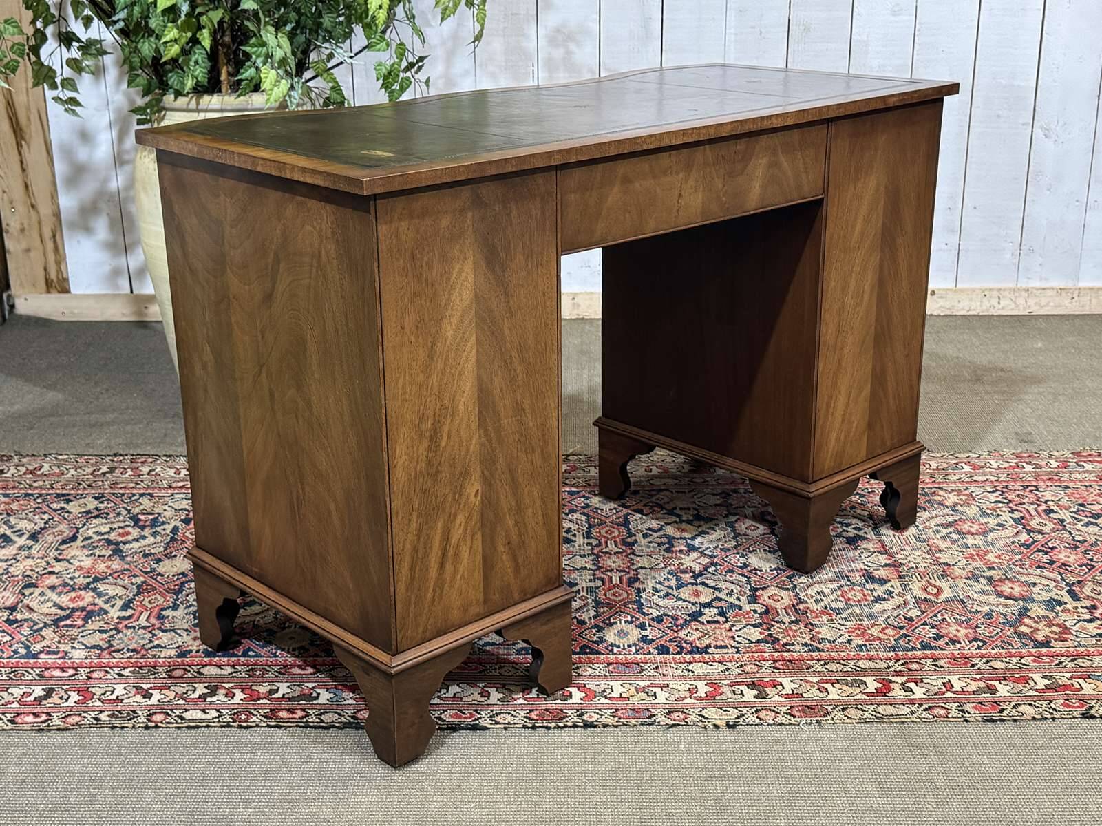 English desk from the 1950s in mahogany with a leather top.