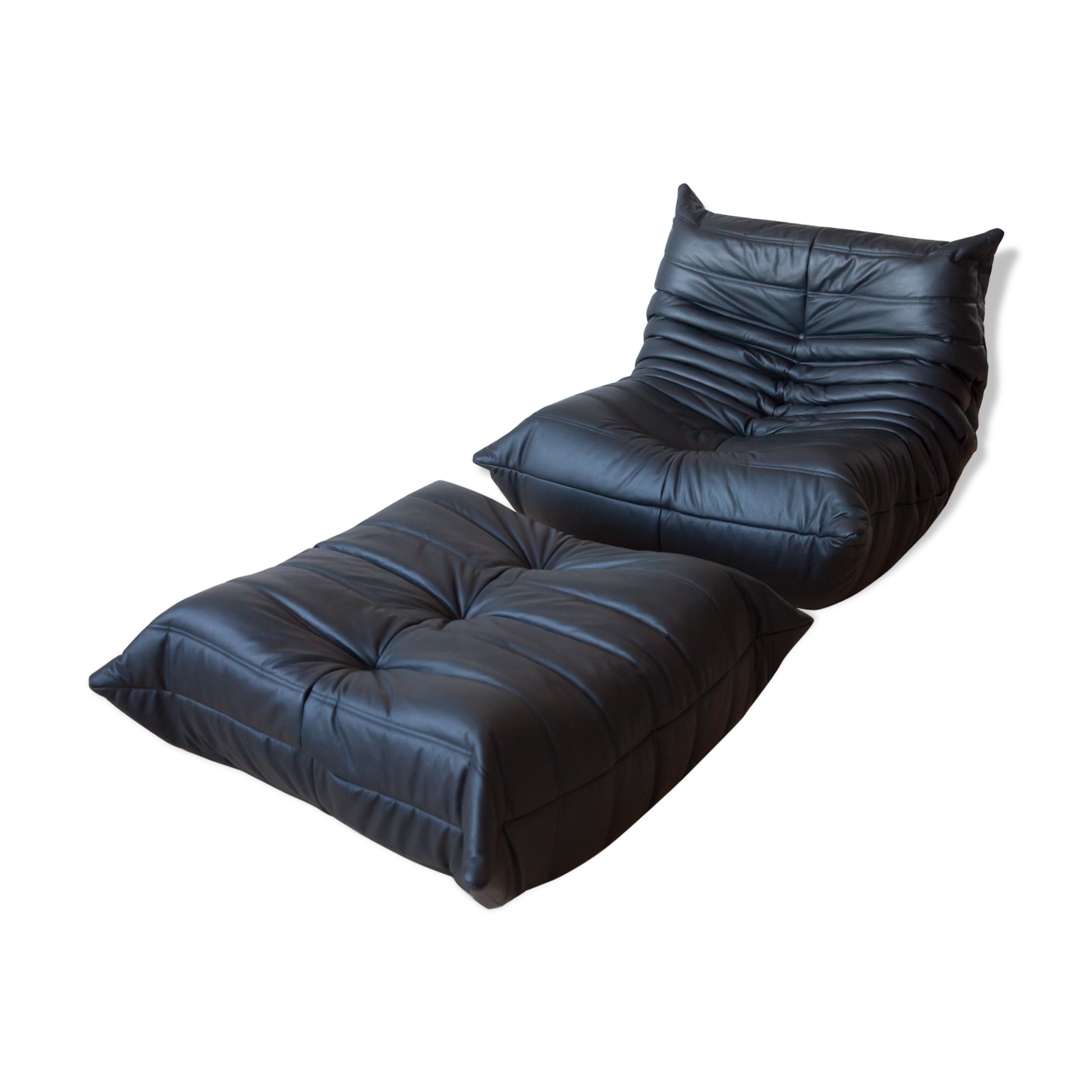 Armchair and ottoman in black leather model designed by Michel Ducaroy 1973