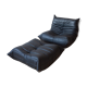 Armchair and ottoman in black leather model designed by Michel Ducaroy 1973