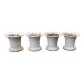 Series of 4 old cast iron vases