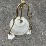 Antique brass chandelier with 3 lights and frosted glass shades.