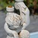 Pair of "cherub" candle holders in plaster