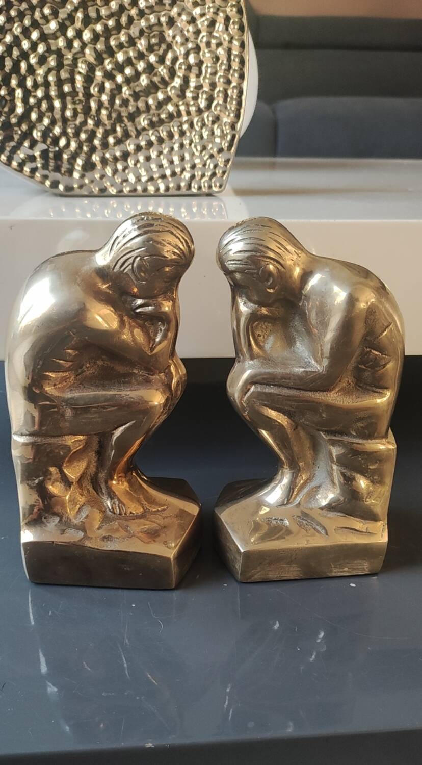 Pair of bookends inspired by Rodin's The Thinker. In gilt bronze