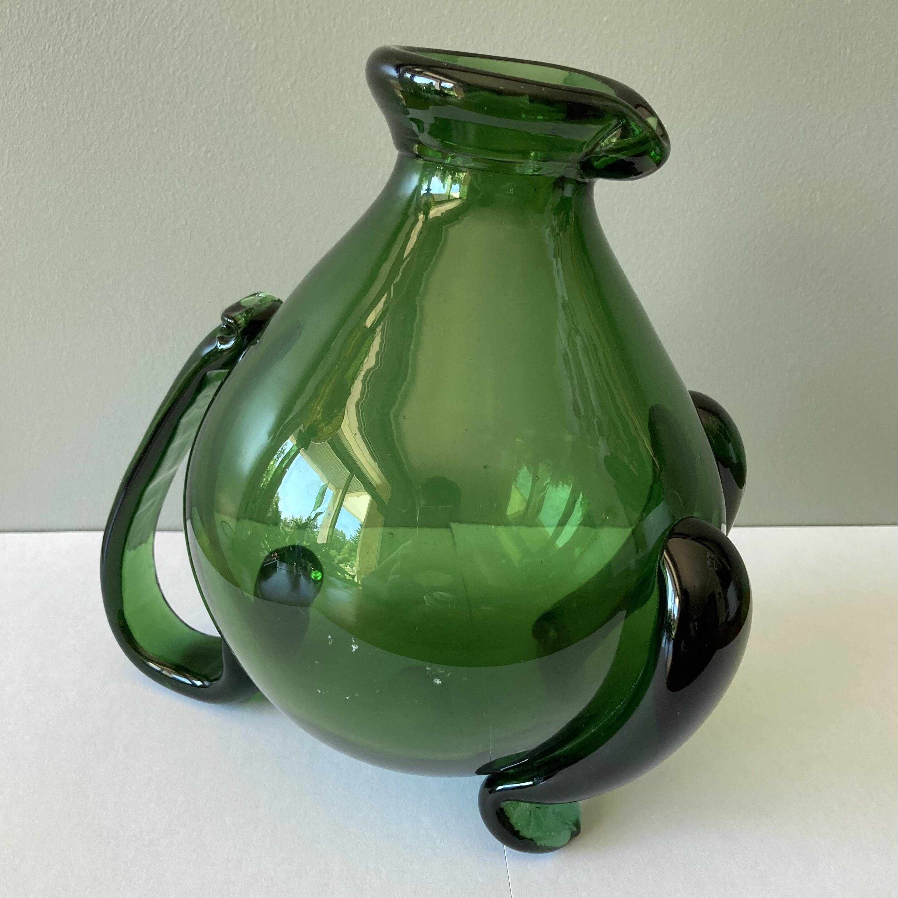 Amazing pitcher; vintage tripod jug or carafe in blown and hot-worked green glass