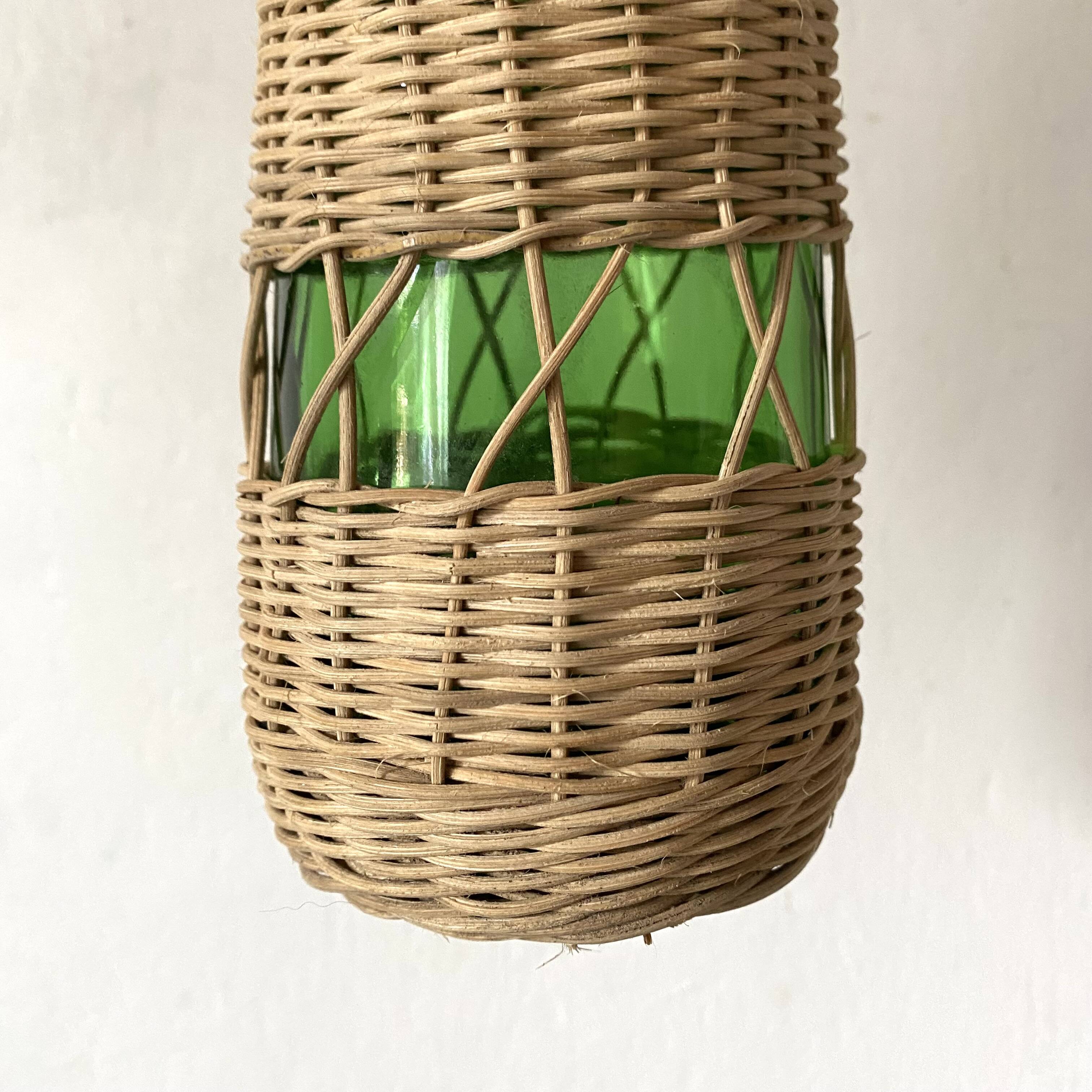 Glass bottles and woven rattan