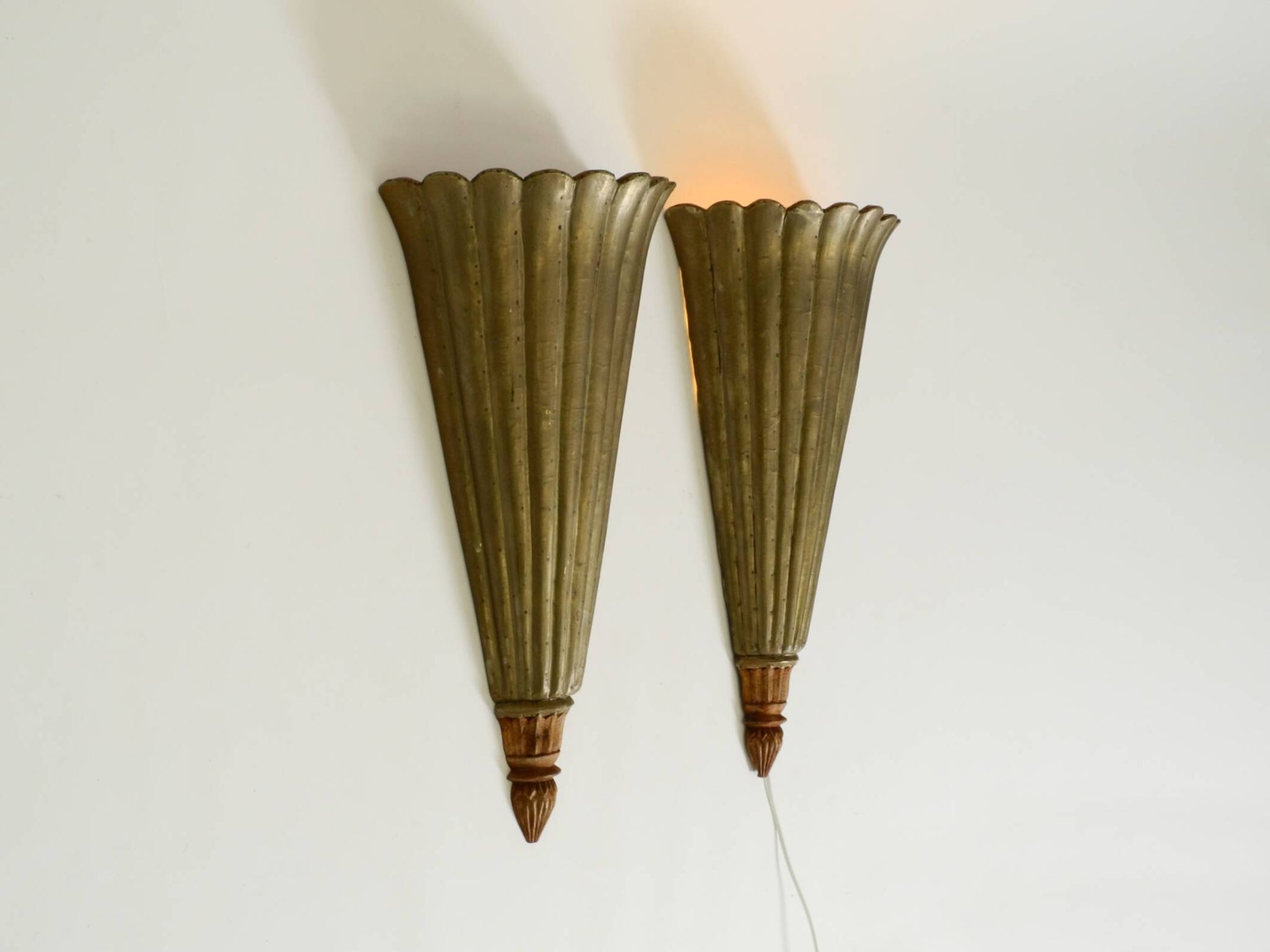 Two large, rare 1950s wall lamps made of wood with aluminum cladding