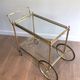 Brass rolling table with removable double trays from Maison Jansen.
