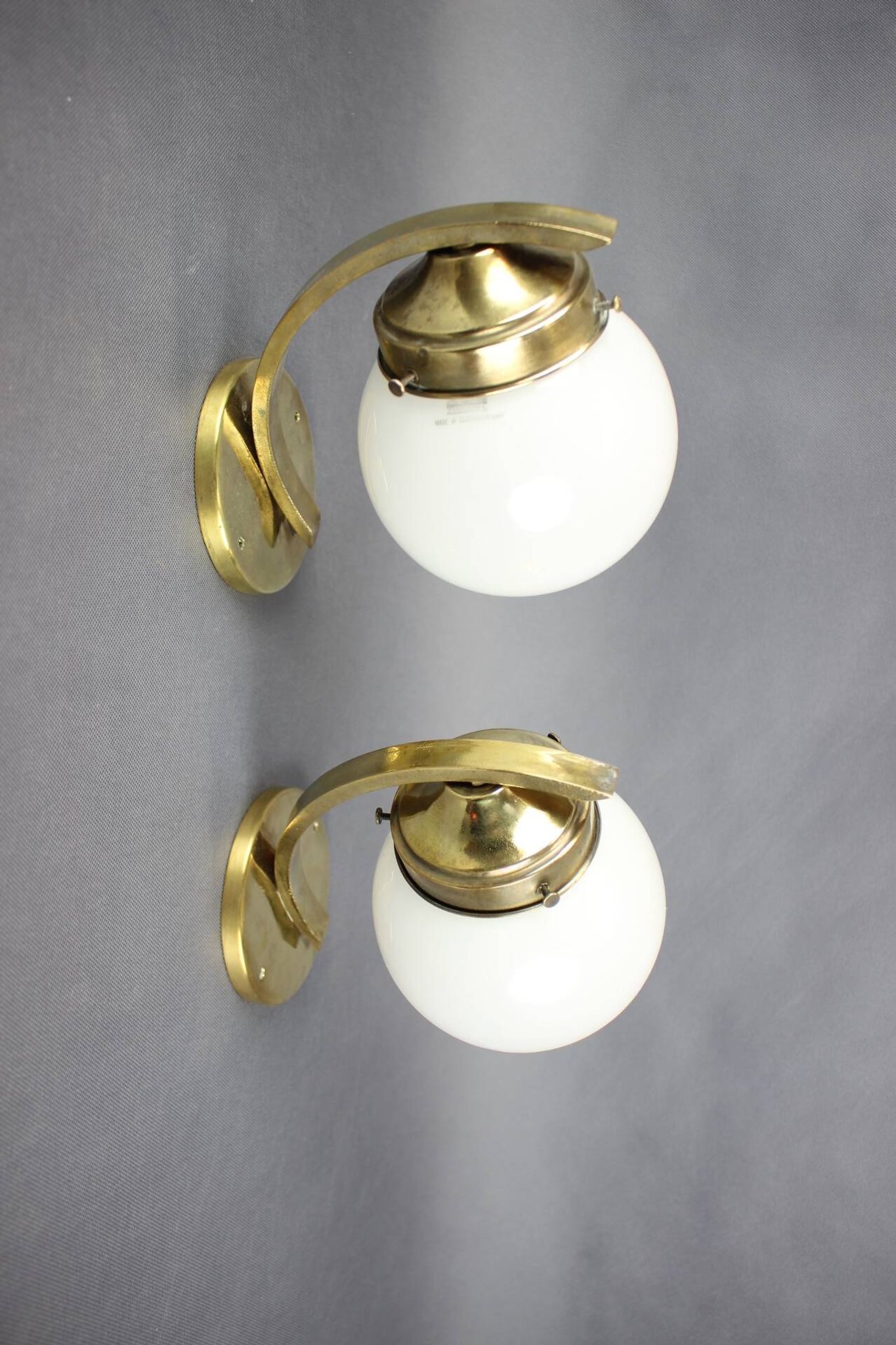 Pair of Art Deco wall sconces in brass and opaline glass, Europe, 1930s