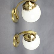 Pair of Art Deco wall sconces in brass and opaline glass, Europe, 1930s