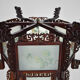 Asian wooden lantern carved with dragons and painted glass panels