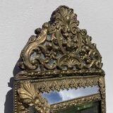 Golden mirror with 19th century embossed brass beads
