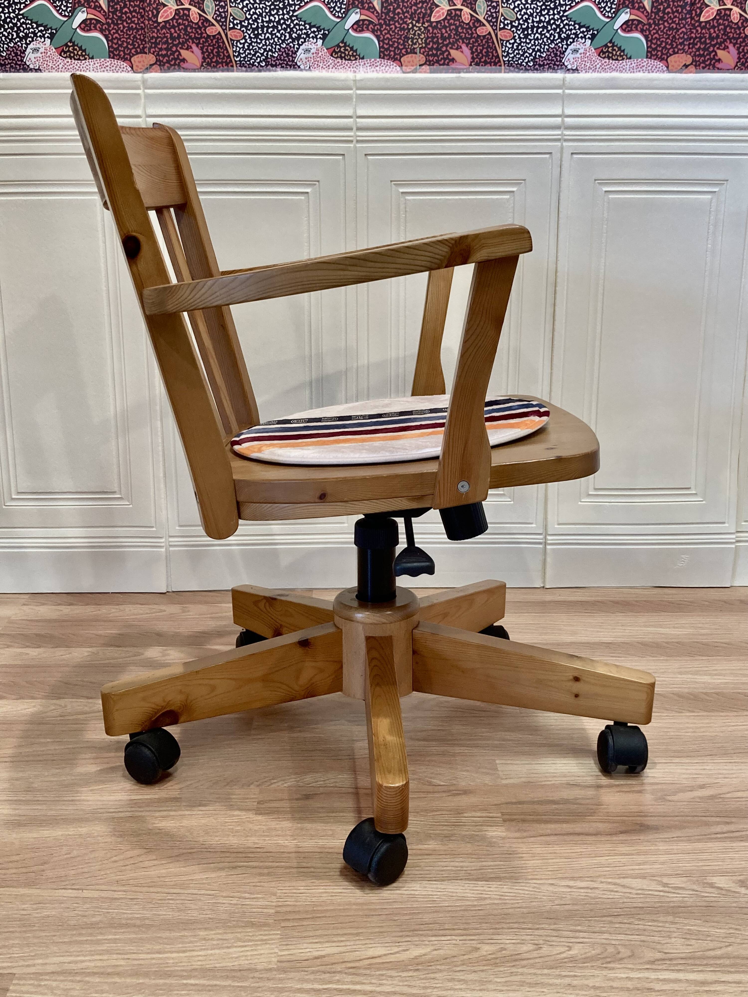 Solid wood swivel and reclining armchair.