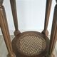 Antique marquetry side table in wood and cane.
