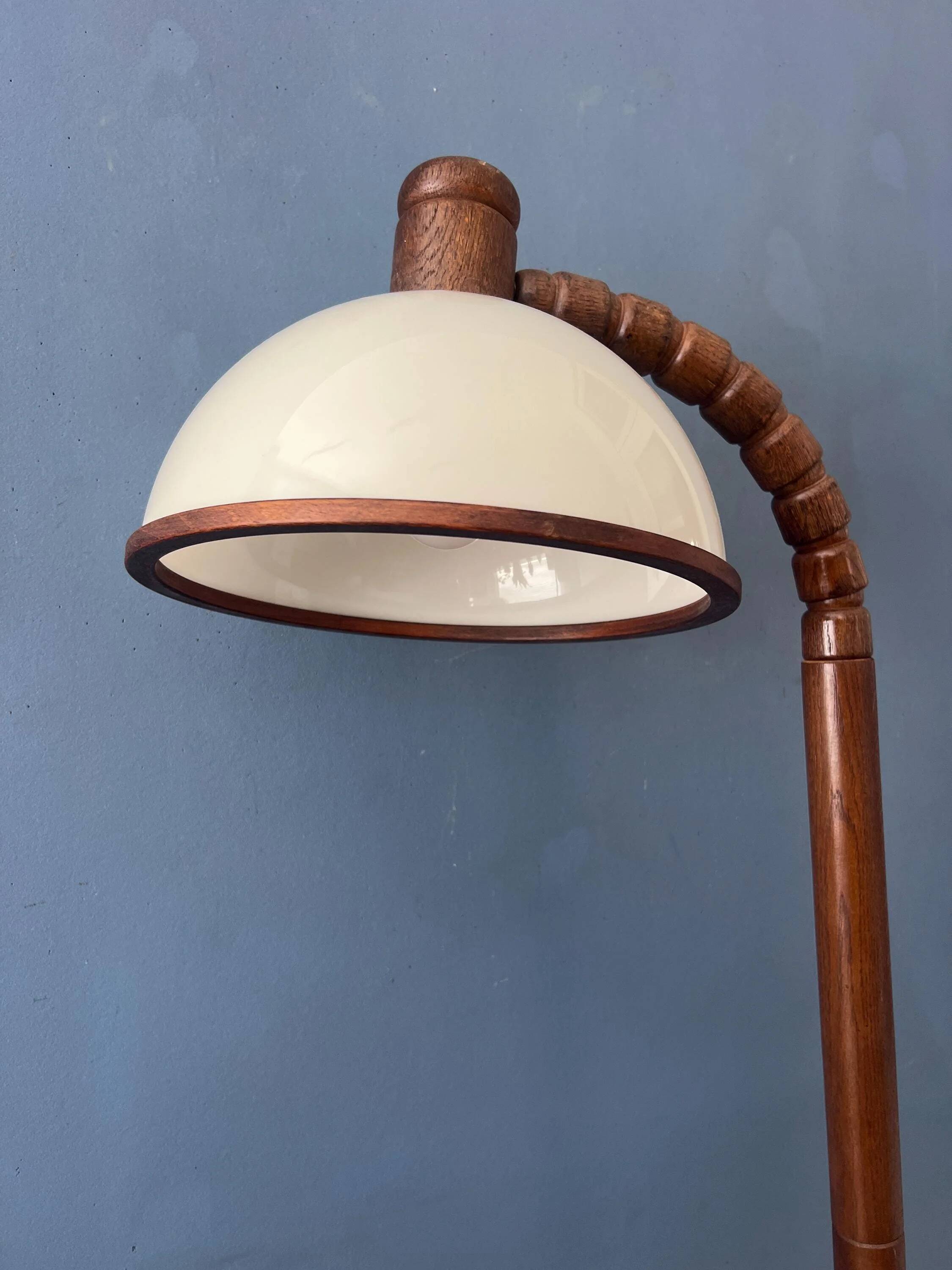 Mid-century floor lamp in brown wood by Steinhauer with an acrylic glass shade.