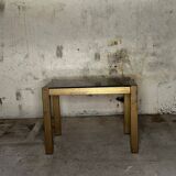 Trio of nesting tables, brass structures and smoked mirror tops