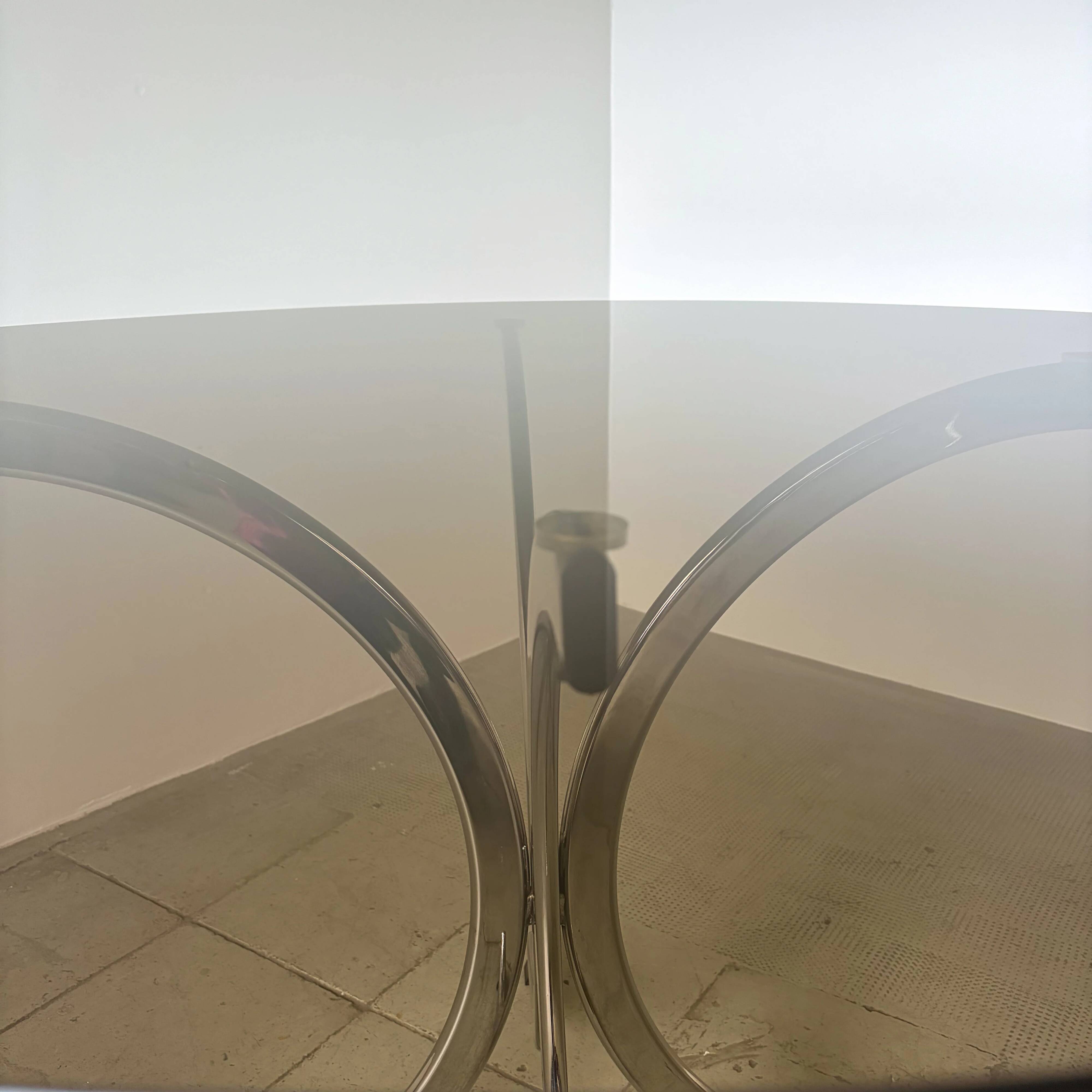 1970s Italian dining table in smoked glass and chrome.