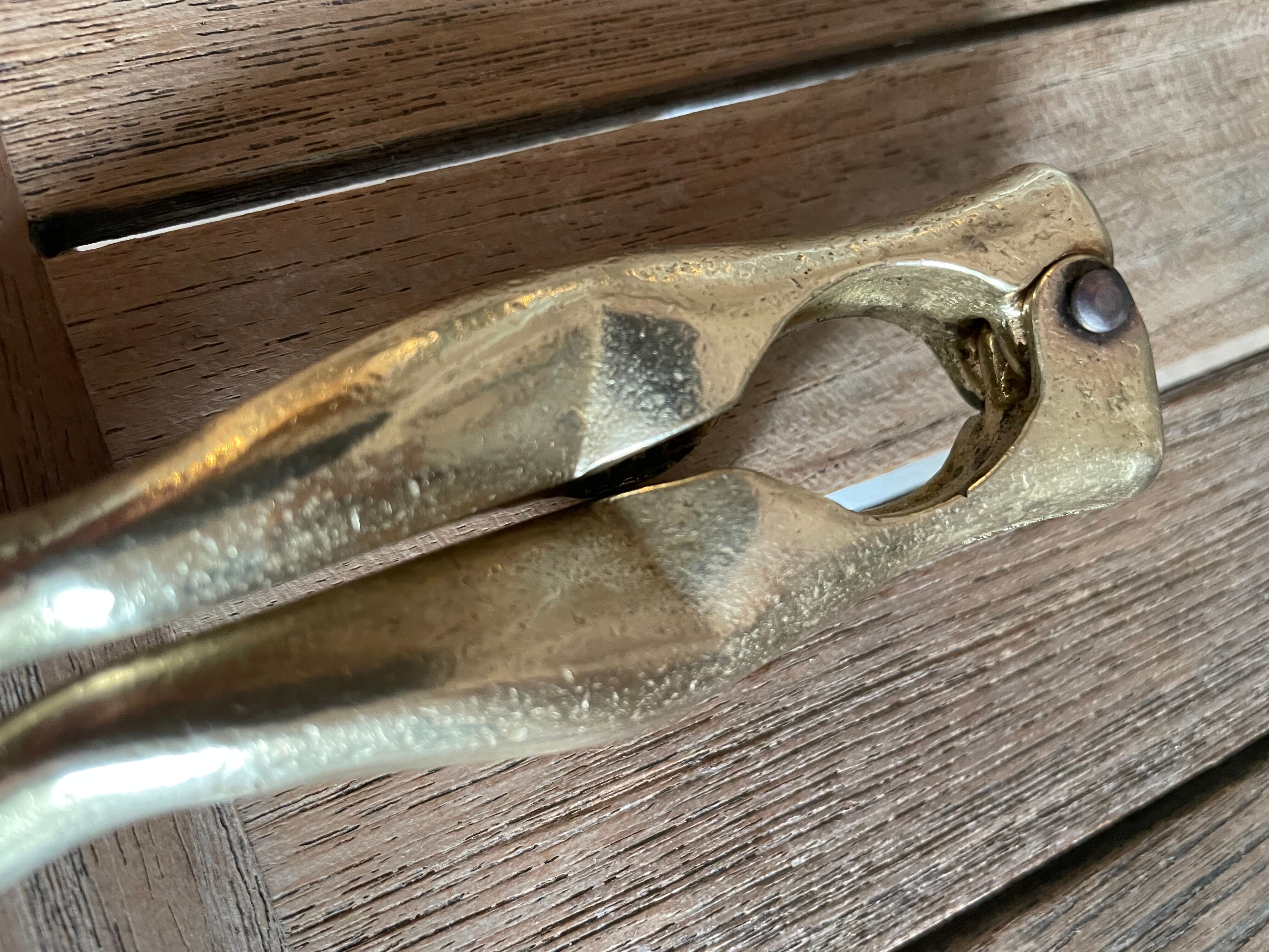 Walnut breaker in the shape of women's legs golden brass vintage