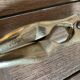 Walnut breaker in the shape of women's legs golden brass vintage