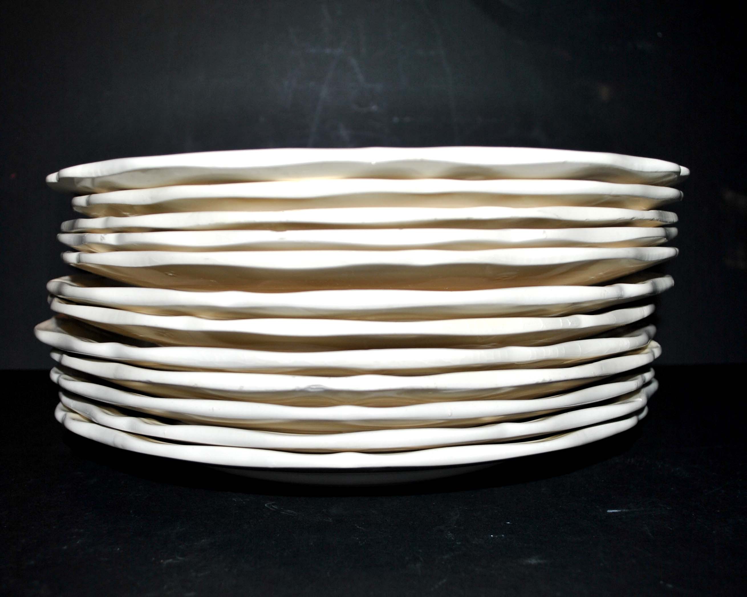 Sarreguemines series of 12 flat plates in opaque faience cream "terre de fer"