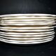 Sarreguemines series of 12 flat plates in opaque faience cream "terre de fer"