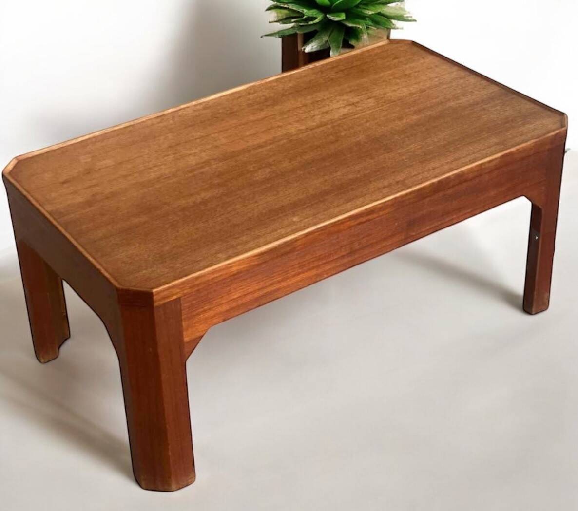 Teak coffee table with beveled legs, circa 1960