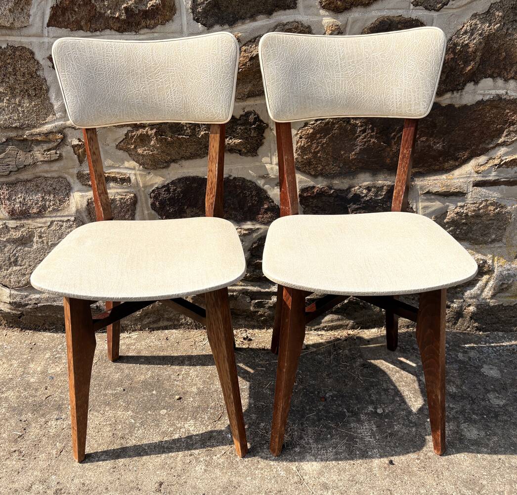 Pair of vintage chairs with upholstered backrest and seat, 1950s style.