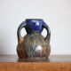 Blue vase in flaming sandstone