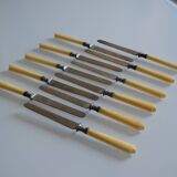 11 antique 19th-century table knives with ivory-colored monogram handles