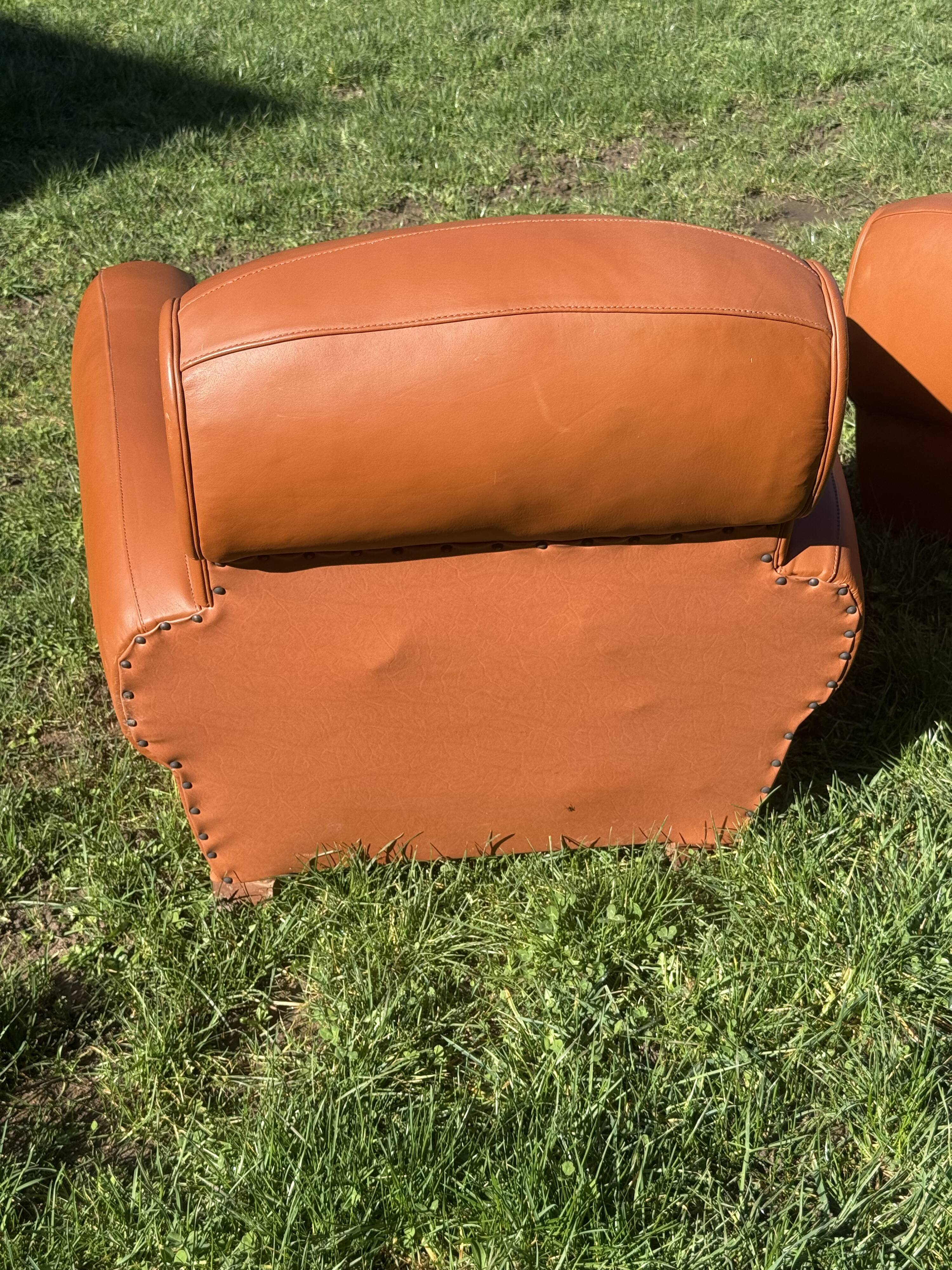 pair of leather clubs