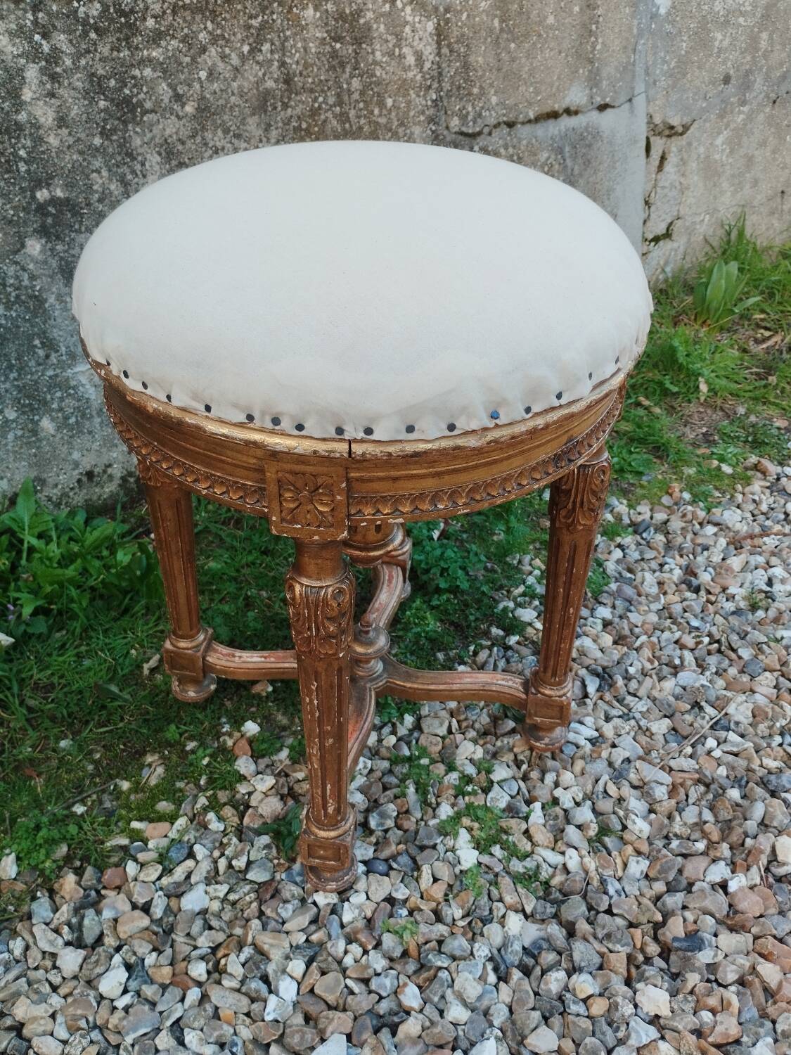 Antique piano stool in gilded wood, Louis XVI style.