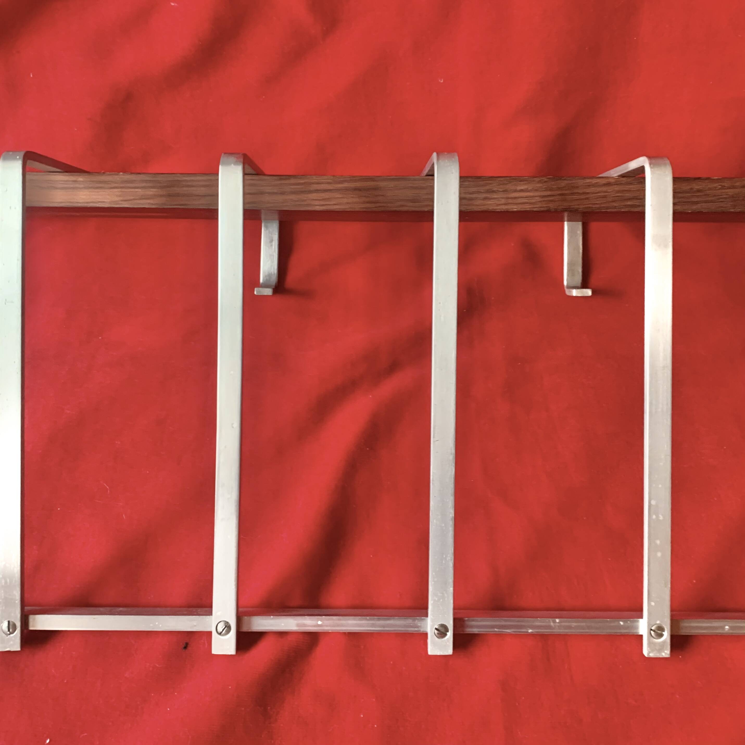 Vintage wall-mounted coat rack made of plywood and aluminum with hat rack