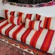 Set of covers for cream and red Moroccan floor sofa.