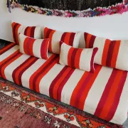 Set of covers for cream and red Moroccan floor sofa.