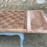 Louis XV style walnut table with a natural wood top.