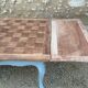 Louis XV style walnut table with a natural wood top.
