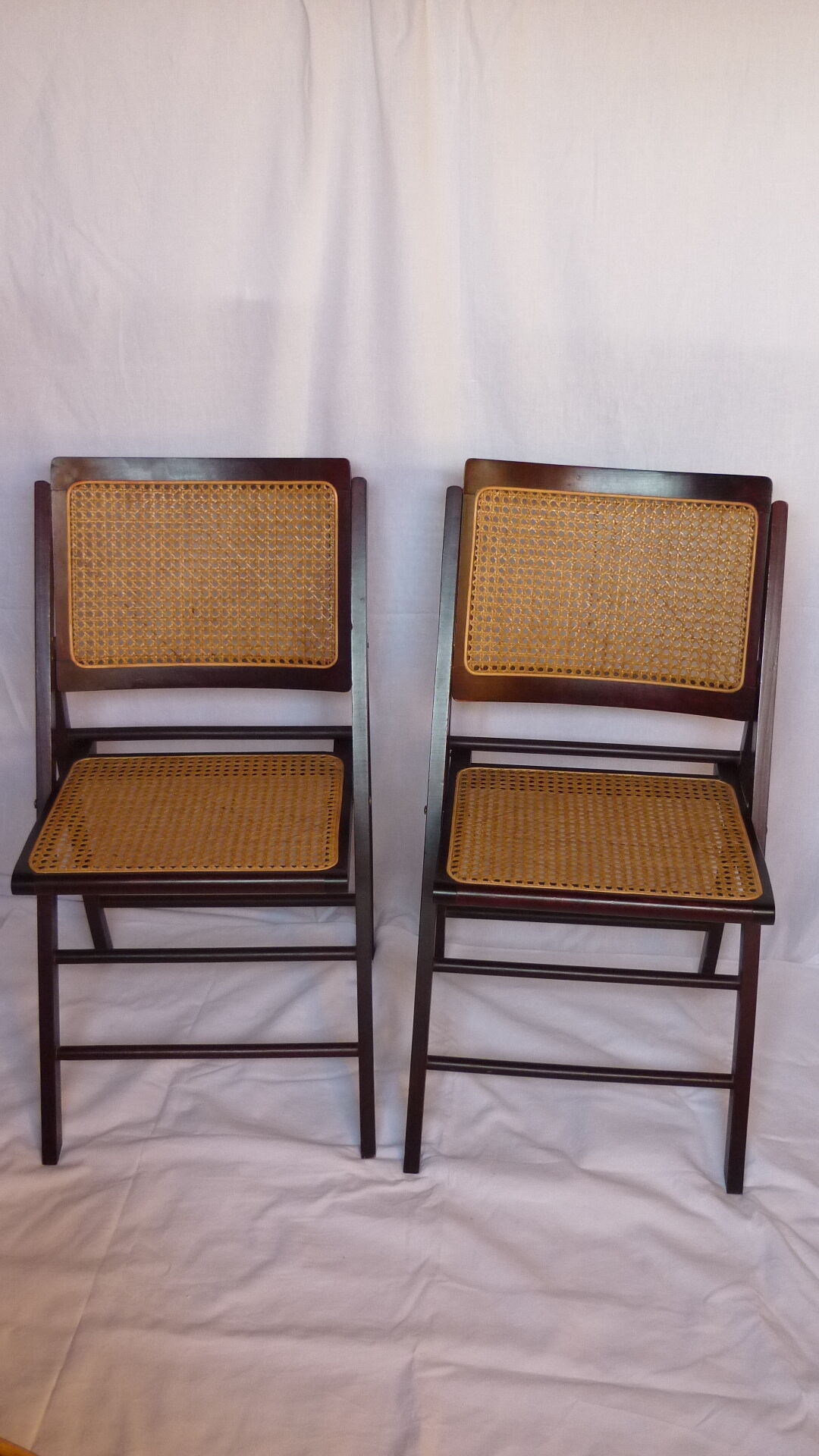 Duo of canned folding chairs