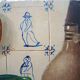Old oil painting: still life with Dutch tiles