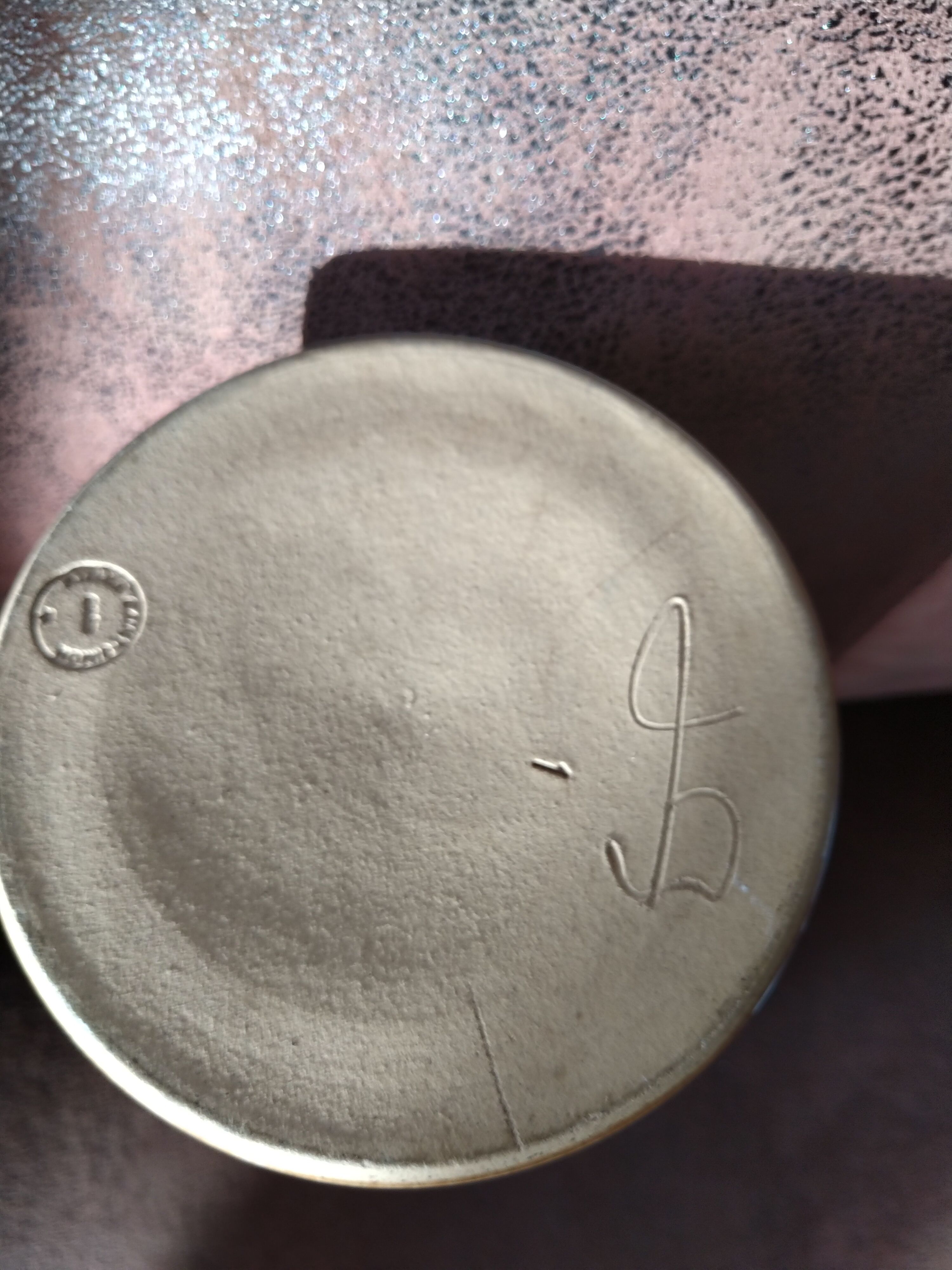 Purple enamelled sandstone vase