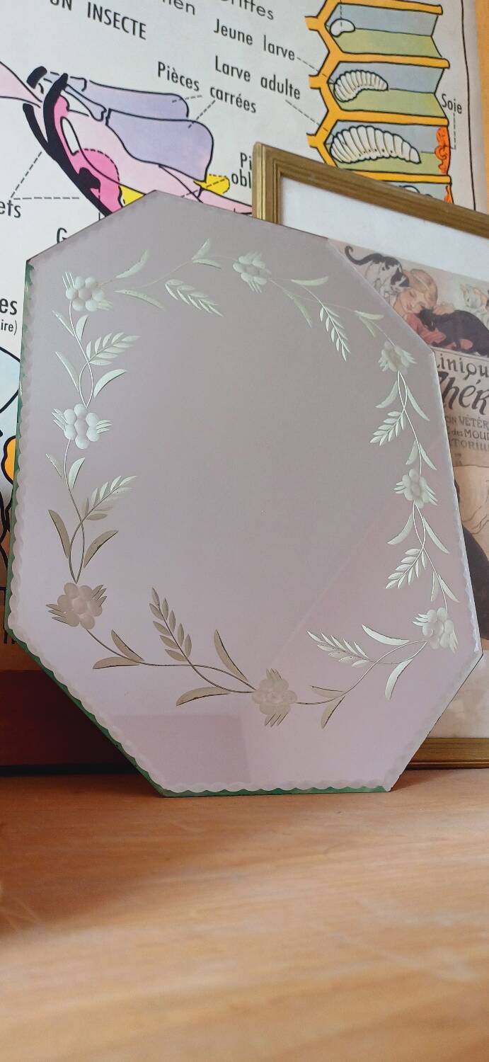 Beveled mirror with floral decor